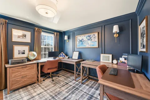 a view of a room with wooden walls