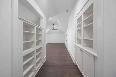 a view of entryway and hall with wooden floor