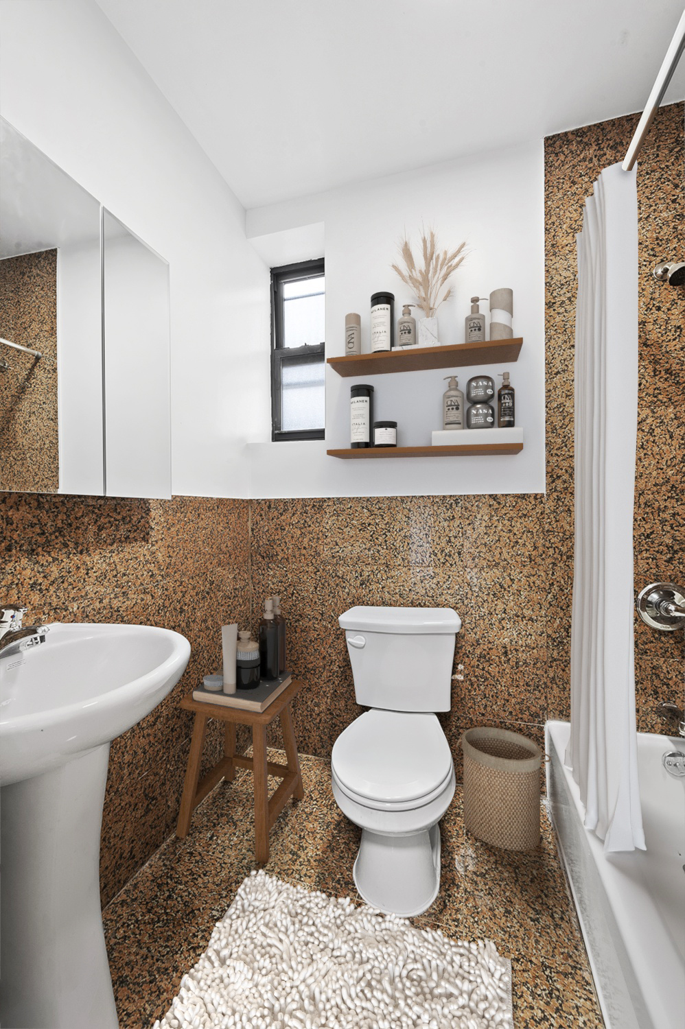 117 Mulberry Street, Unit 9 Manhattan, NY 10013 - Photo 5 of 5 a bathroom with a toilet a sink and a window