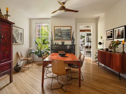 a view of a dining room with furniture window and wooden floor