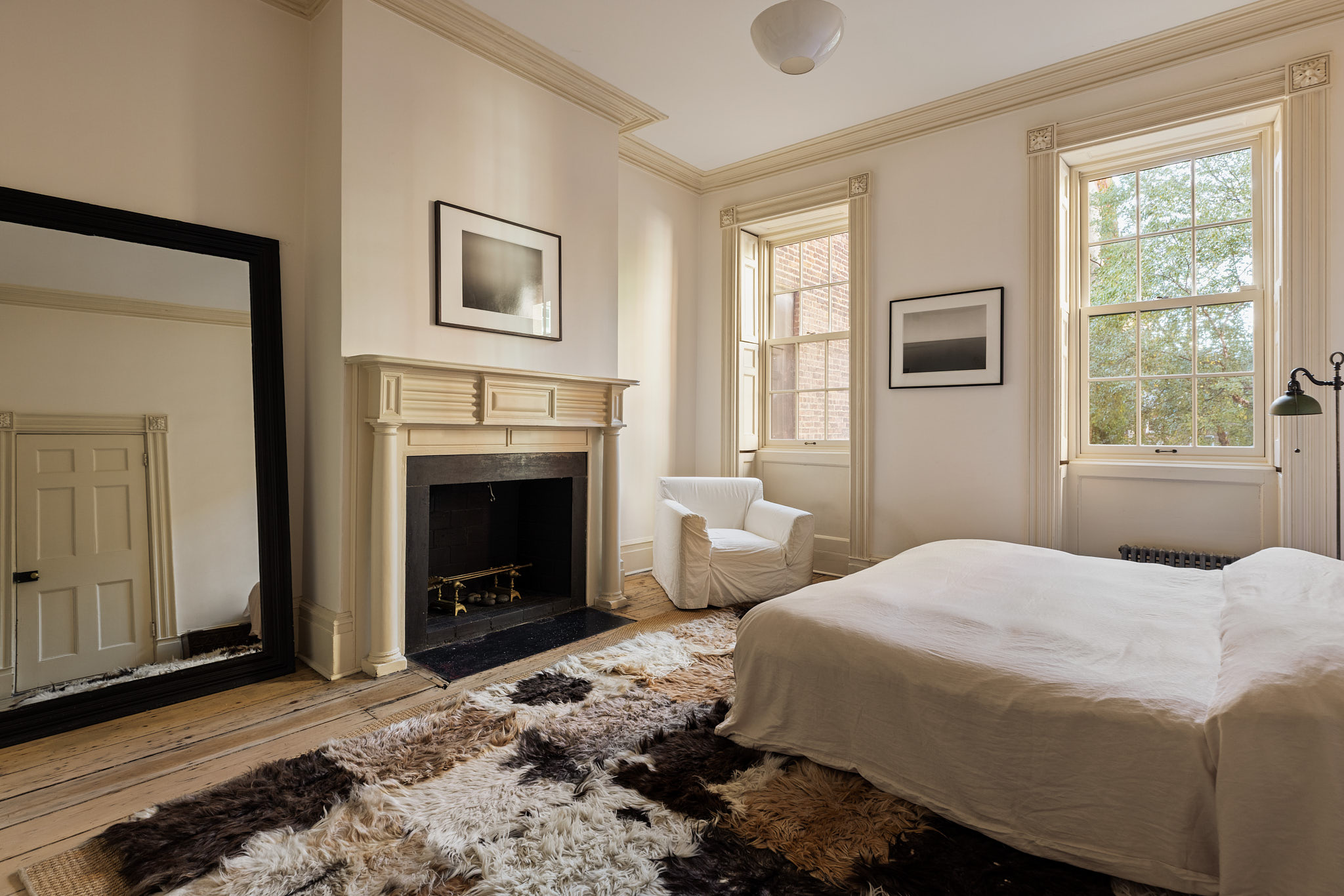 13 Vandam Street Manhattan, NY 10014 - Photo 12 of 26 a bedroom with a bed and a fireplace