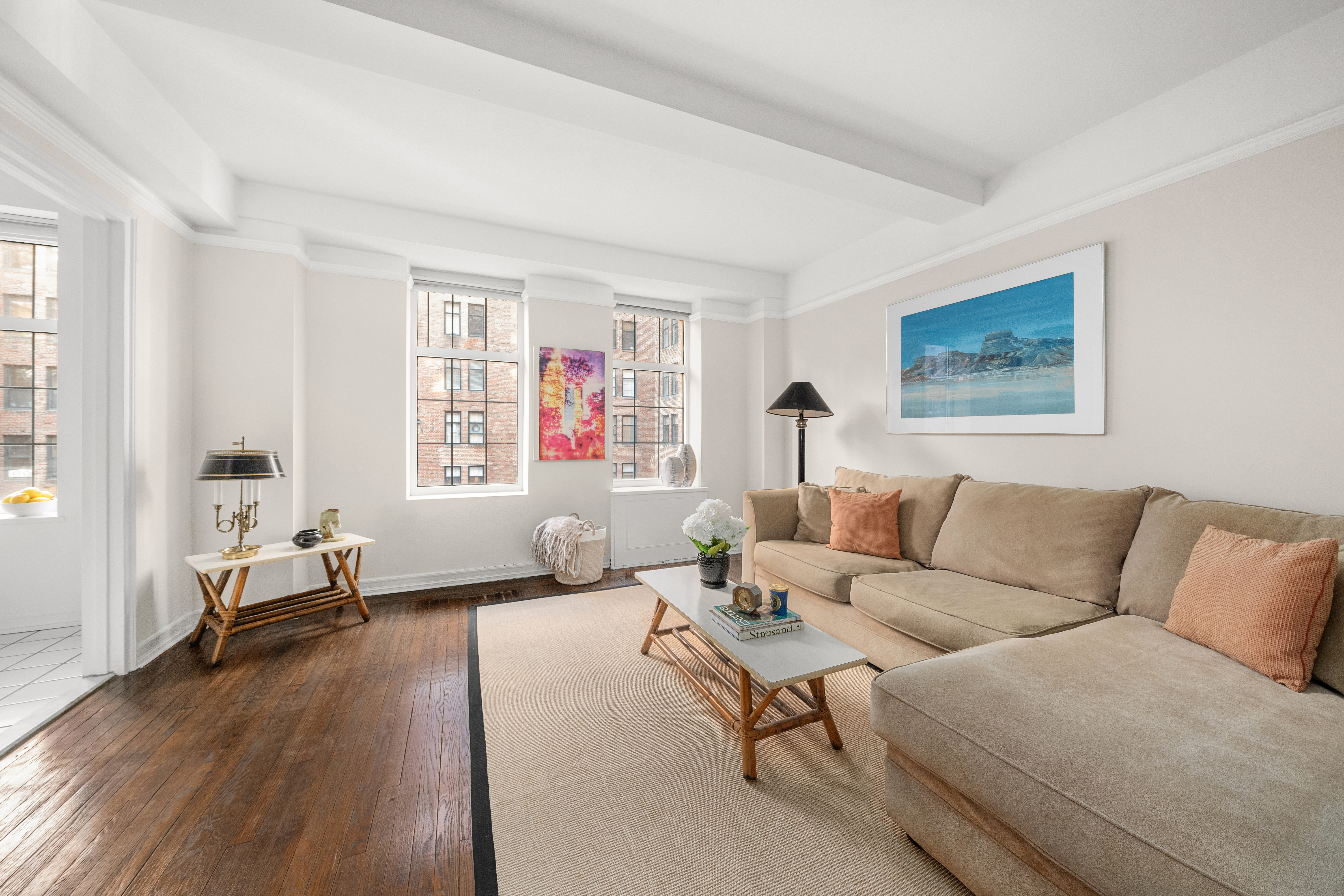 405 West 23rd Street, Unit 9I Manhattan, NY 10011 - Photo 1 of 10 a living room with furniture and a large window