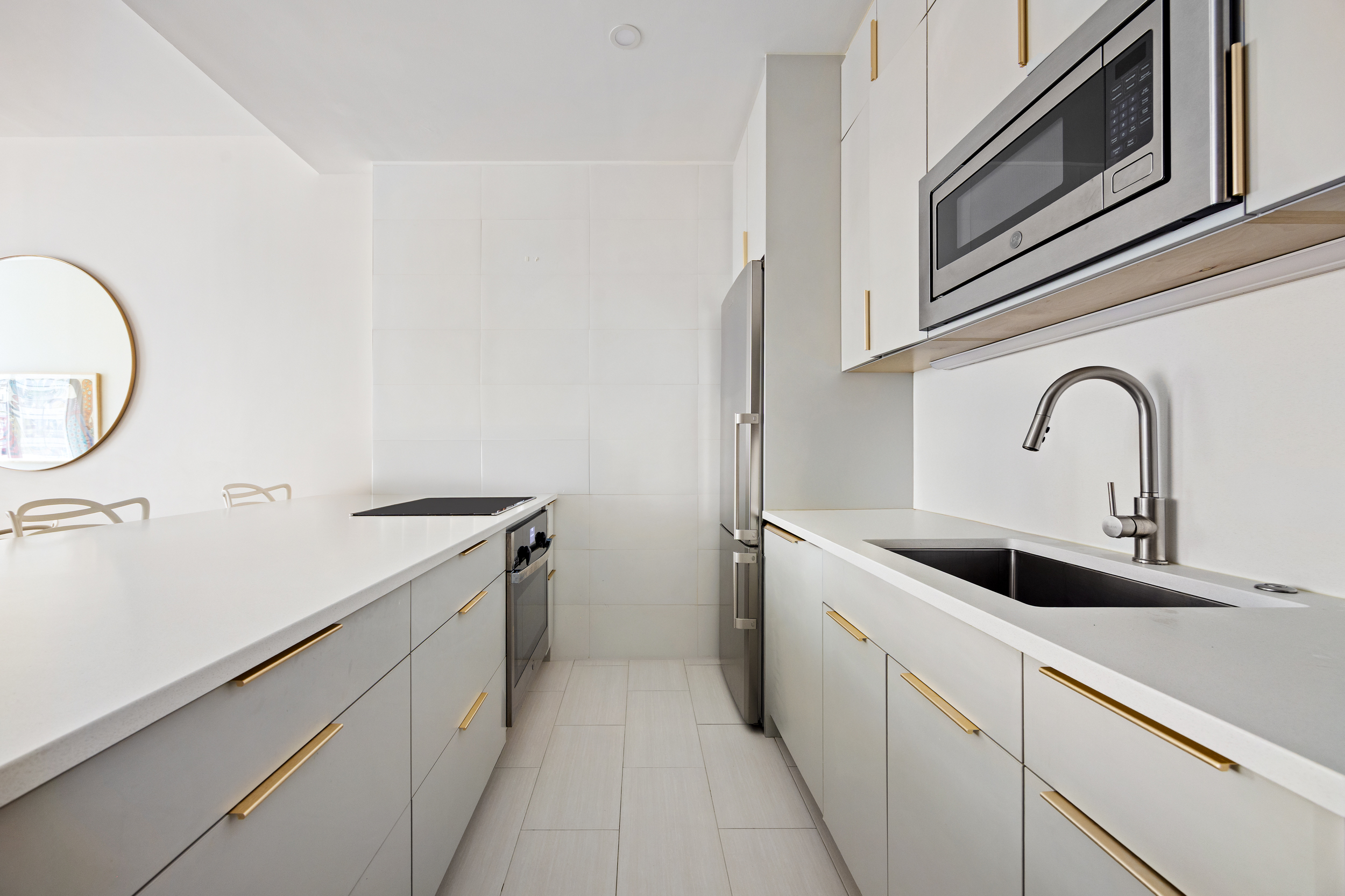 111 Fulton Street, Unit 824 Manhattan, NY 10038 - Photo 6 of 35 a view of a kitchen with sink and washing machine