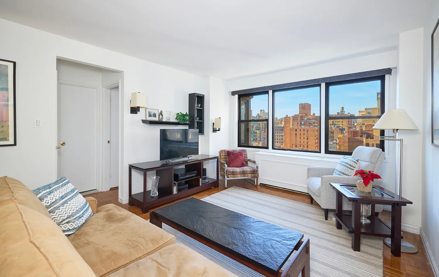 a living room with furniture and a flat screen tv