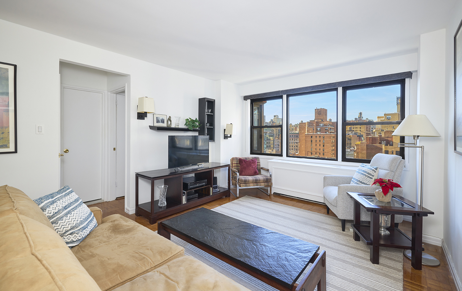 a living room with furniture and a flat screen tv