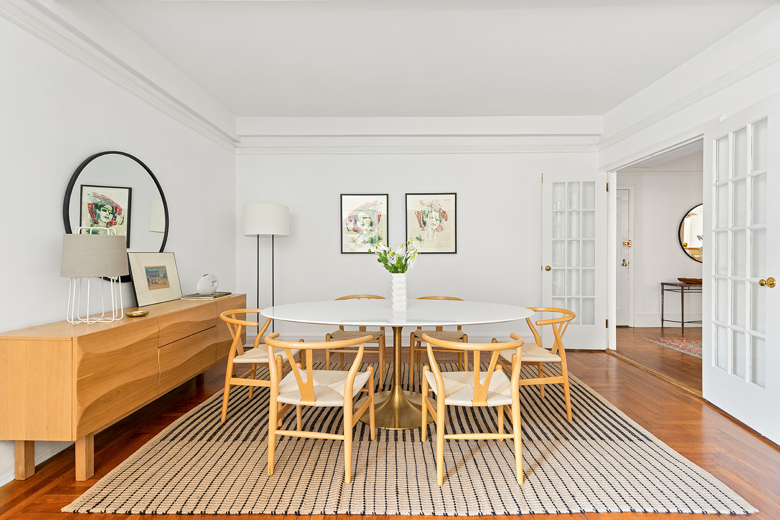 135 Eastern Parkway, Unit 14E Brooklyn, NY 11238 - Photo 2 of 16 a view of a living room and a dining room with wooden floor