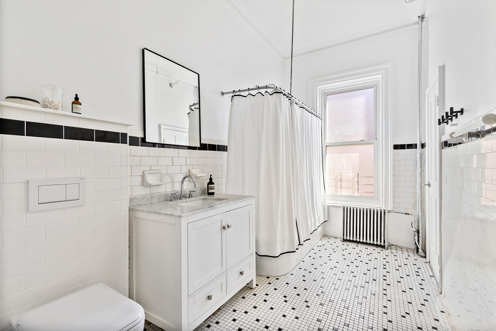 166 Washington Park, Unit 2 Brooklyn, NY 11205 - Photo 4 of 9 a bathroom with a sink a toilet and shower