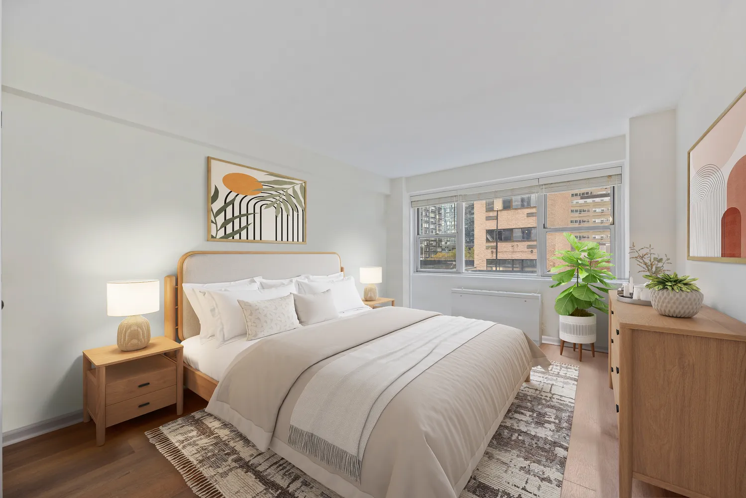 a bedroom with bed and wooden floor
