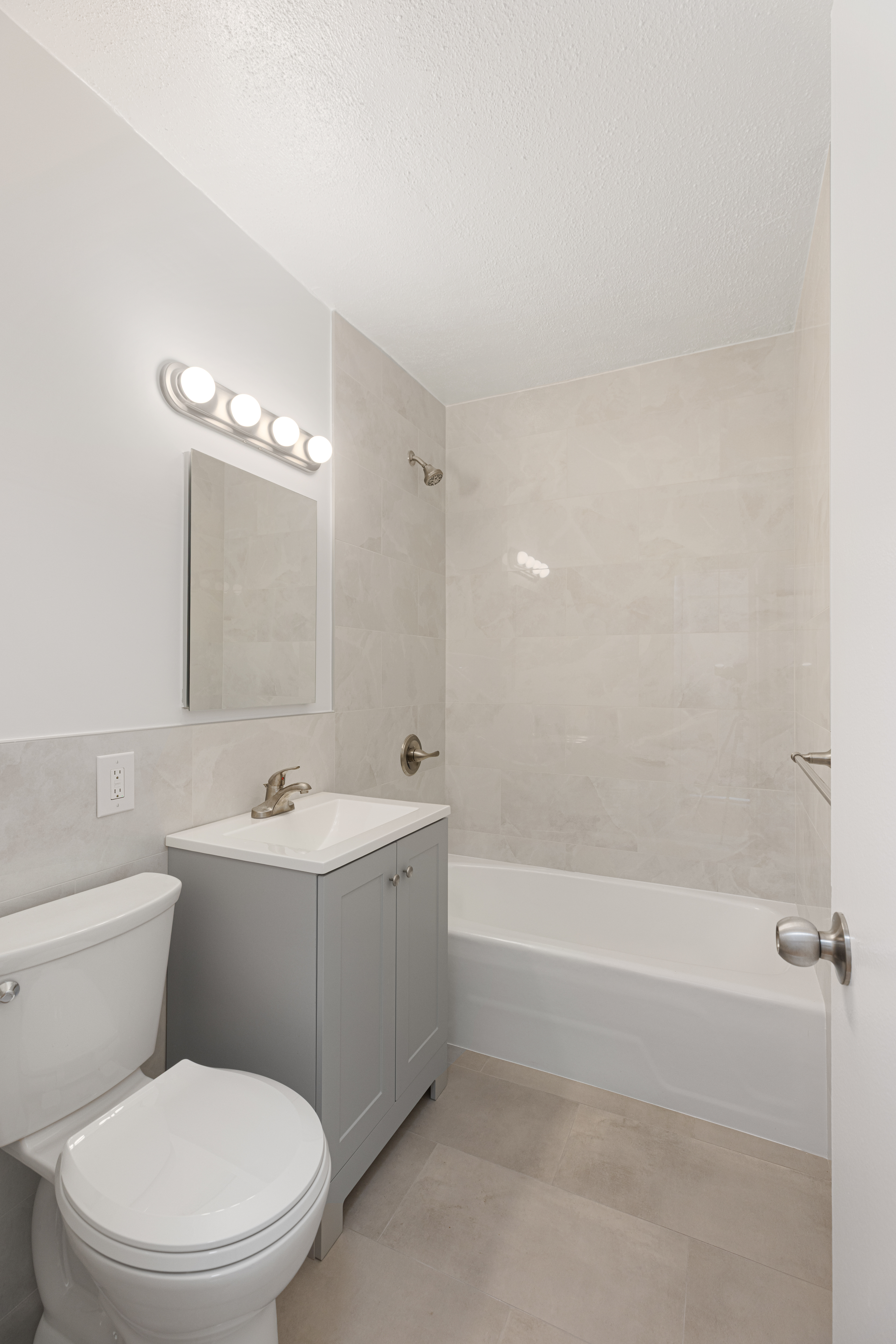20 West 64th Street, Unit 35T Manhattan, NY 10023 - Photo 6 of 7 a bathroom with a toilet a sink and bathtub