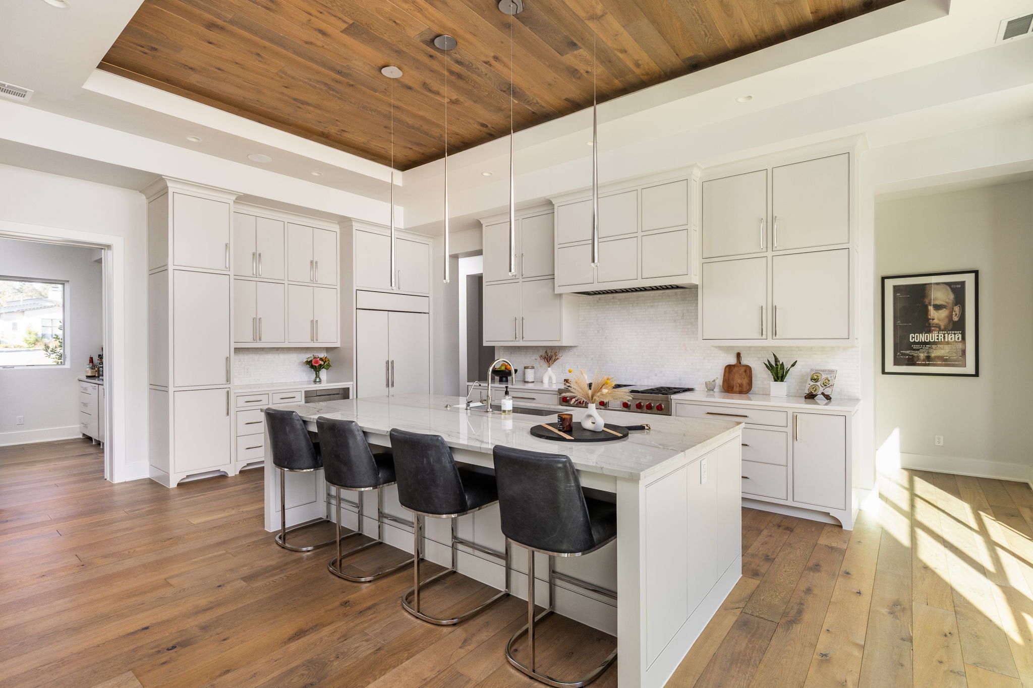 522 Delayne Drive Austin, TX 78737 - Photo 4 of 23 a kitchen with a sink stove and white cabinets with wooden floor