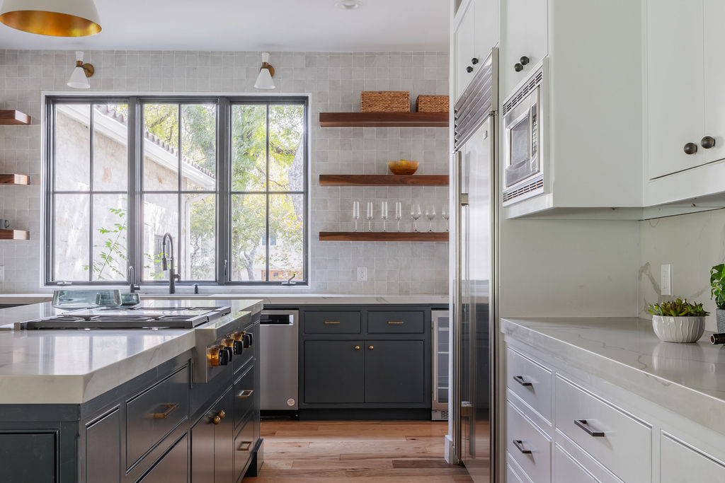 400 Inwood Road Austin, TX 78746 - Photo 13 of 43 a kitchen with stainless steel appliances granite countertop a sink and a stove next to a window