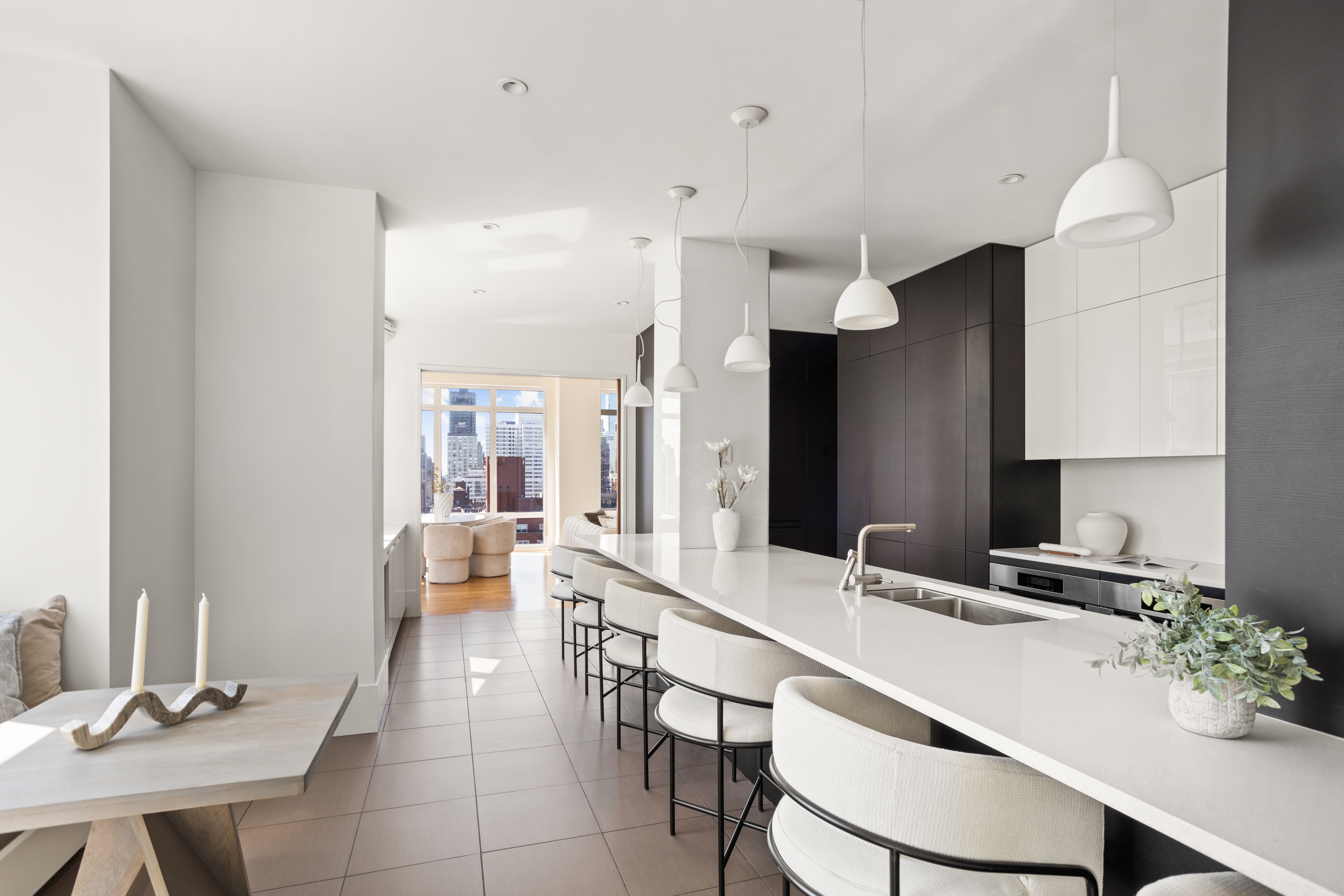 255 East 74th Street, Unit 21B Manhattan, NY 10021 - Photo 6 of 40 a large kitchen with a table and chairs