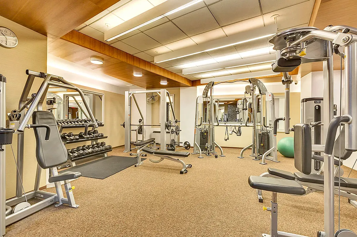 99 John Street, Unit 208 Manhattan, NY 10038 - Photo 9 of 18 a view of a room with gym equipment