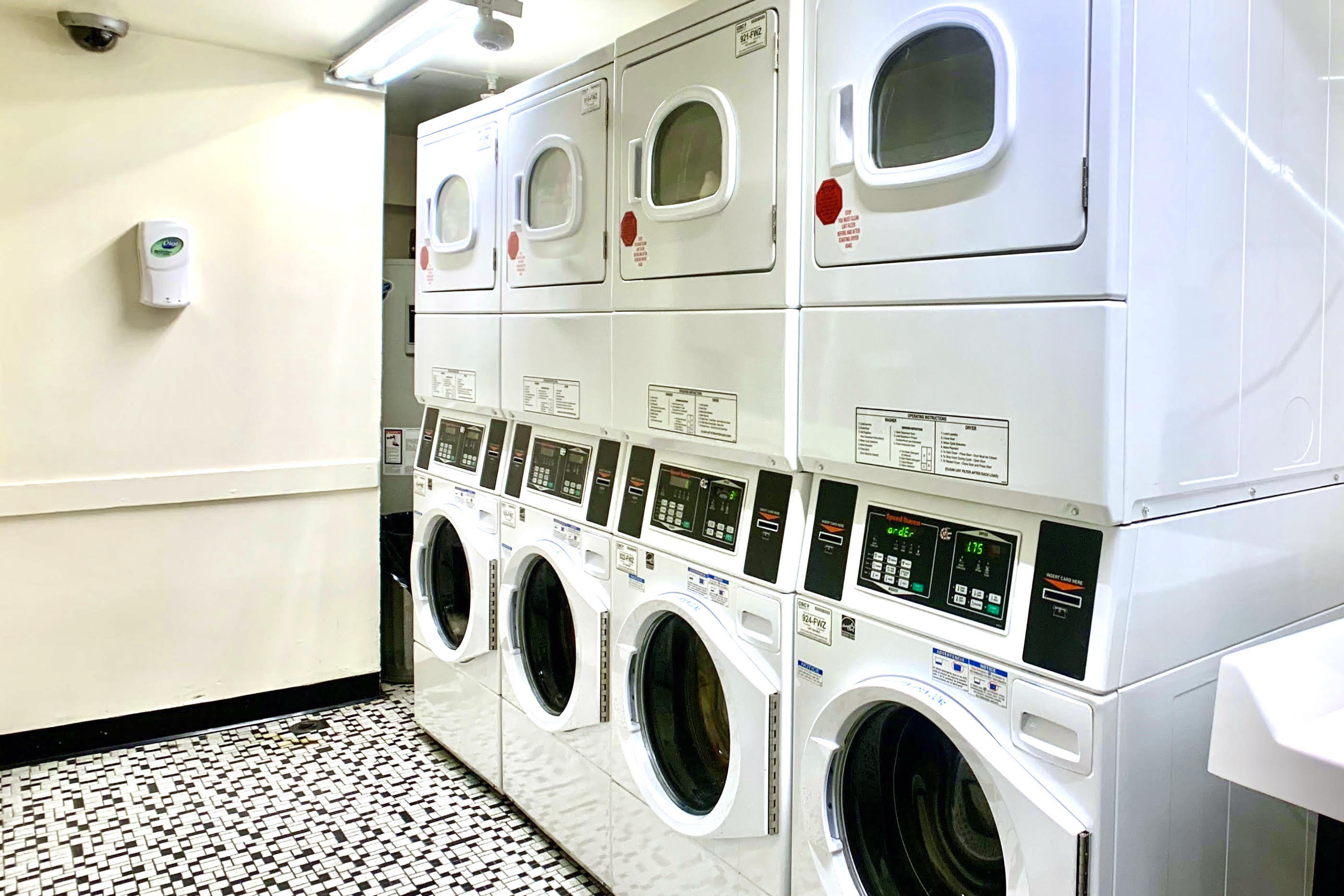 45 Overlook Terrace, Unit 4E Manhattan, NY 10033 - Photo 11 of 17 a utility room with dryer and washer