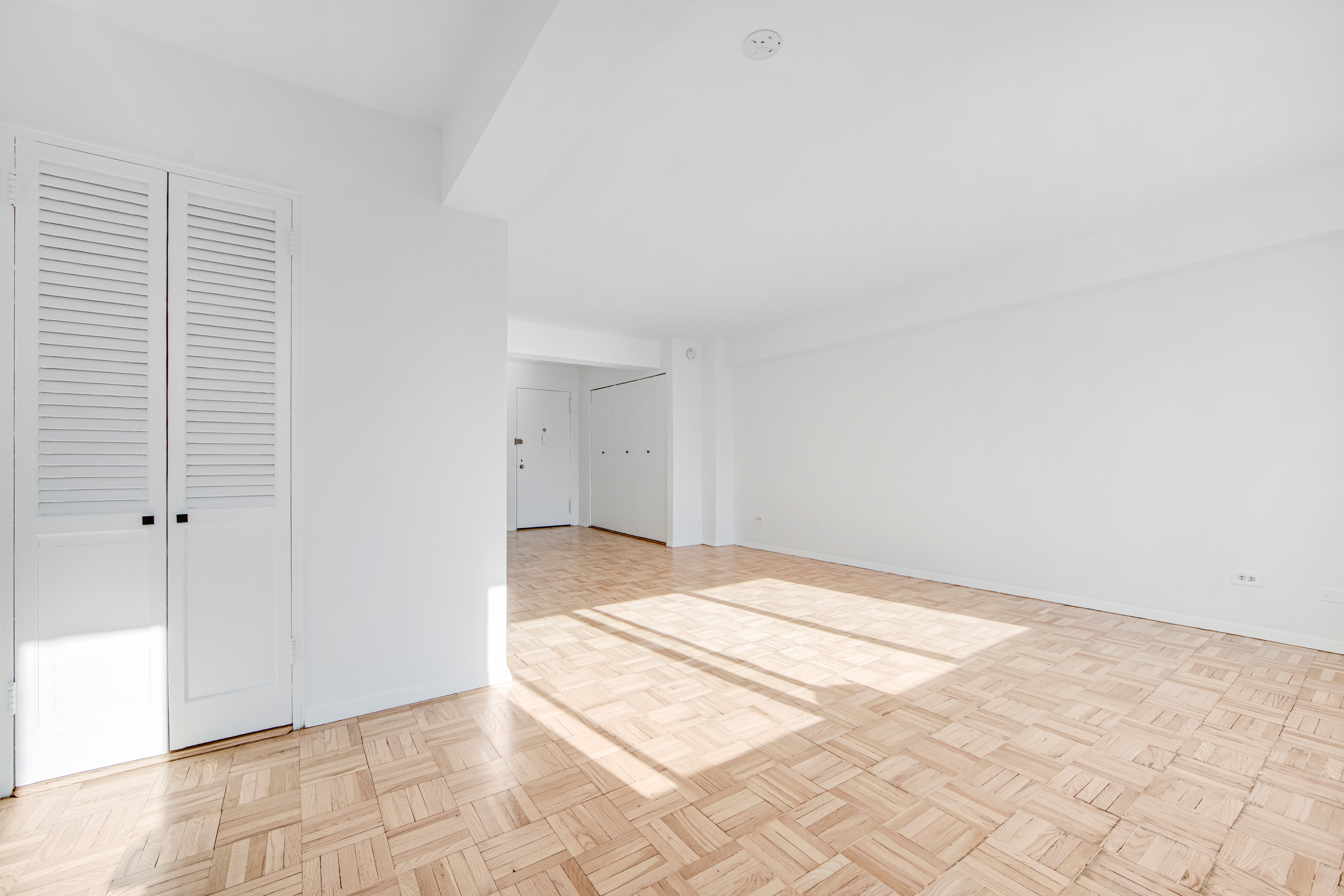 401 East 65th Street, Unit 10H Manhattan, NY 10065 - Photo 7 of 14 a view of an empty room