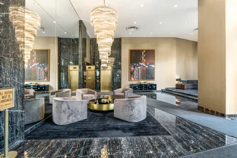 a living room with lots of furniture and a rug