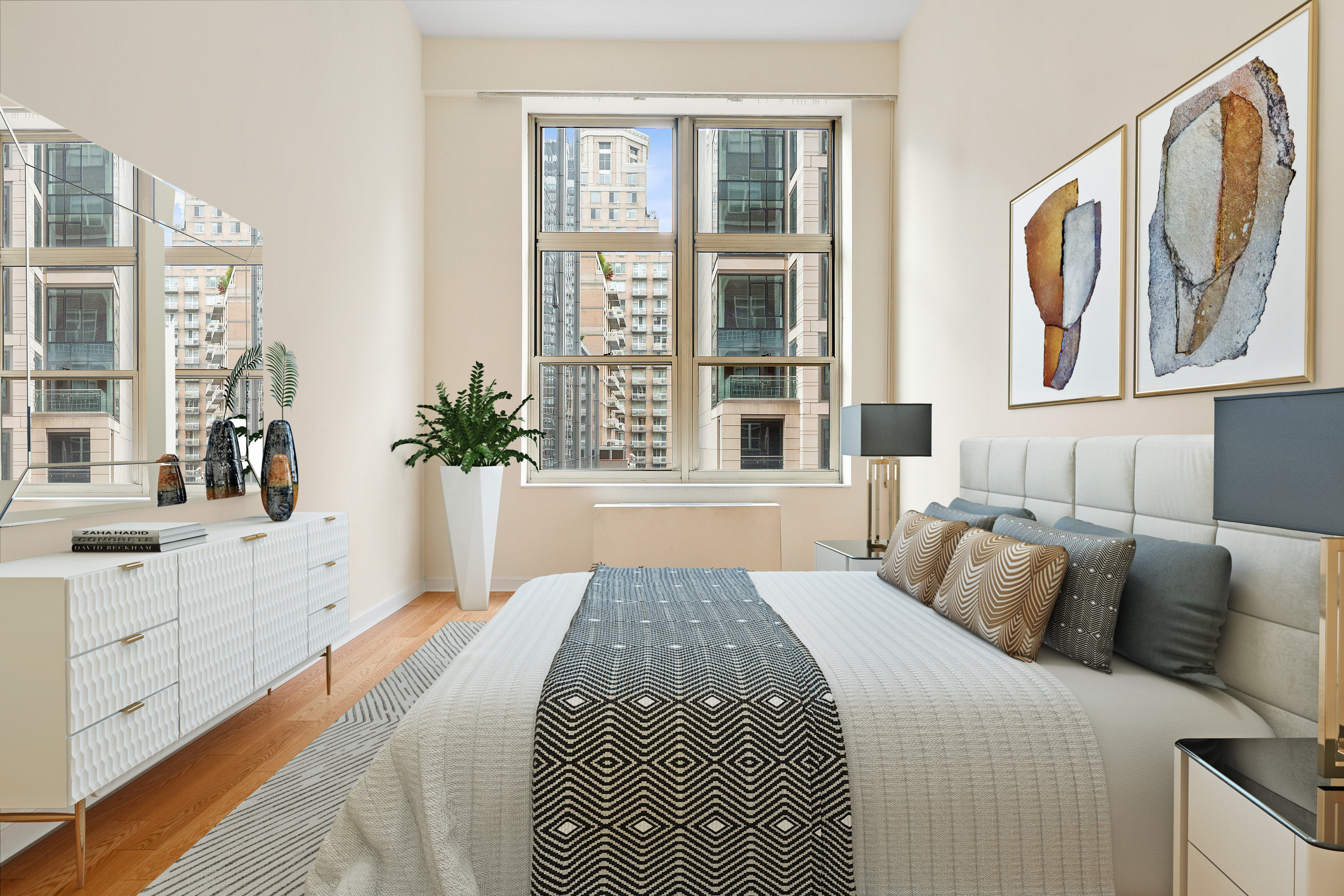 120 East 87th Street, Unit R10C Manhattan, NY 10128 - Photo 4 of 13 a large bed sitting in a bedroom next to a window