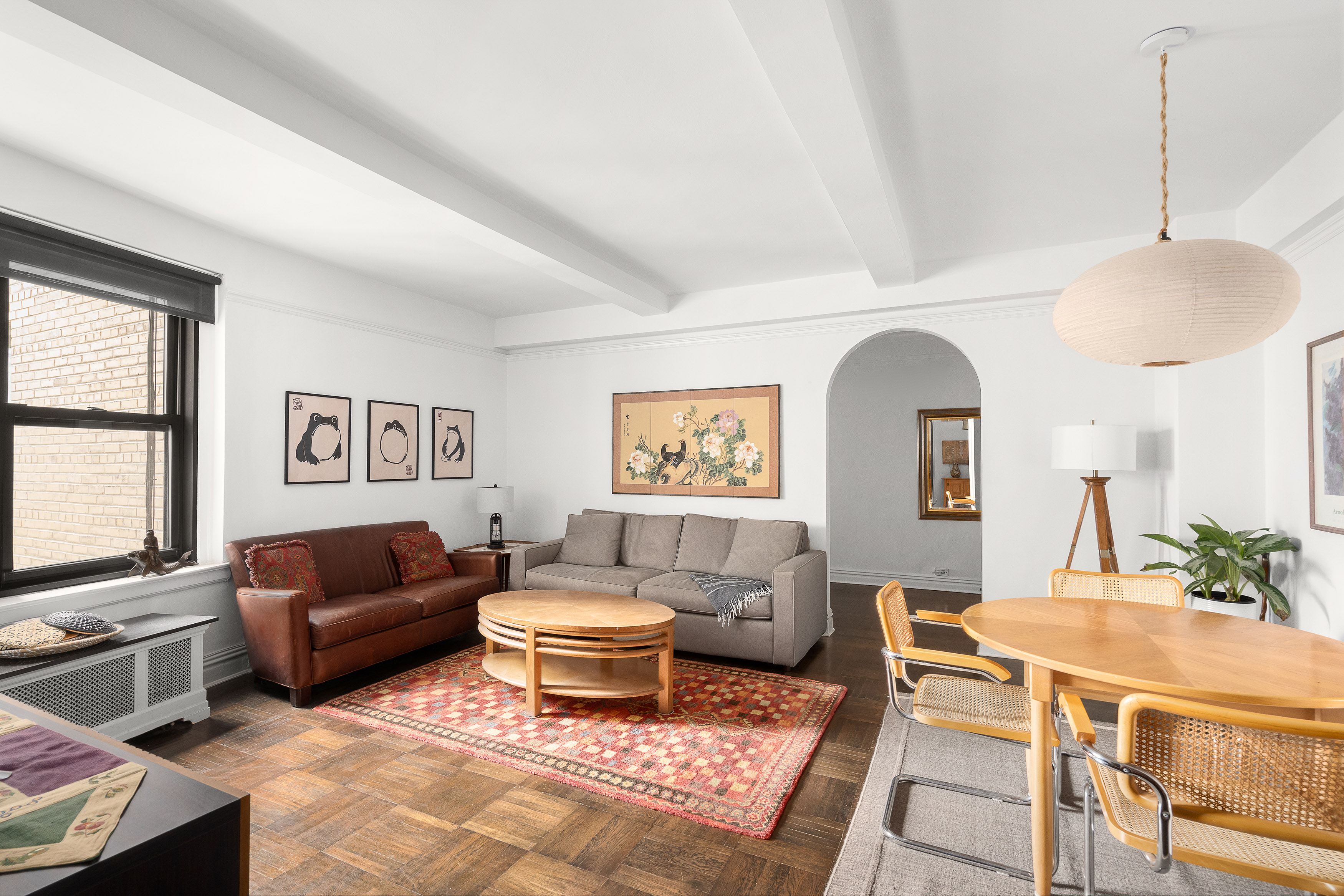 235 West End Avenue, Unit 8D Manhattan, NY 10023 - Photo 1 of 11 a living room with furniture and a window