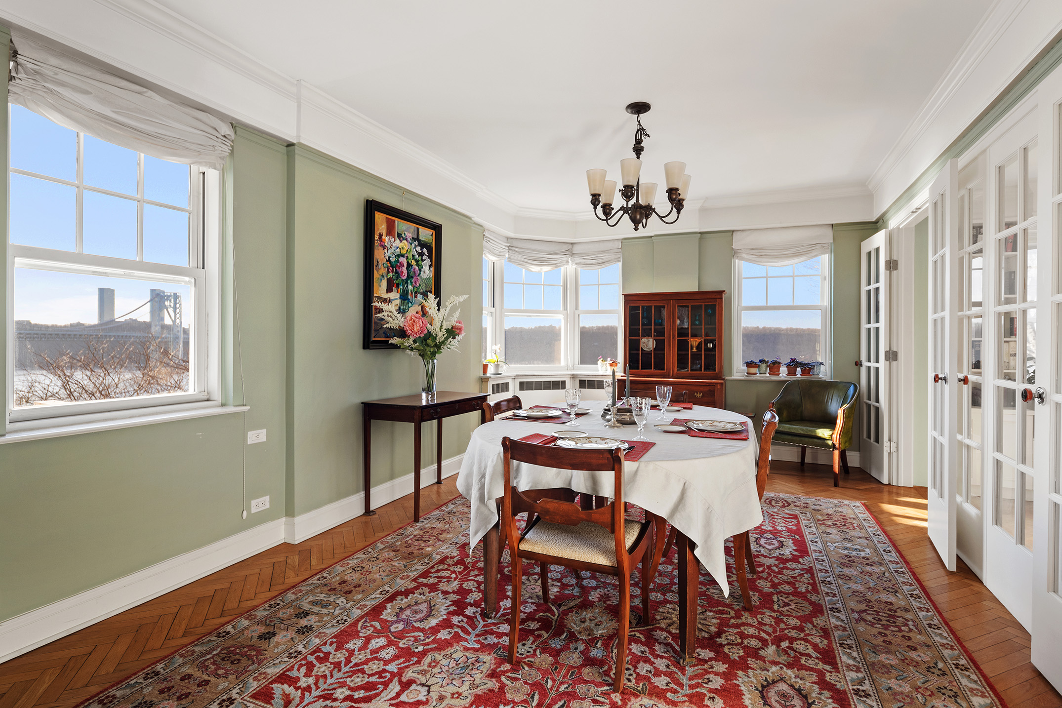 140 Cabrini Boulevard, Unit 18/19 Manhattan, NY 10033 - Photo 6 of 21 a view of a dining room with furniture window and wooden floor
