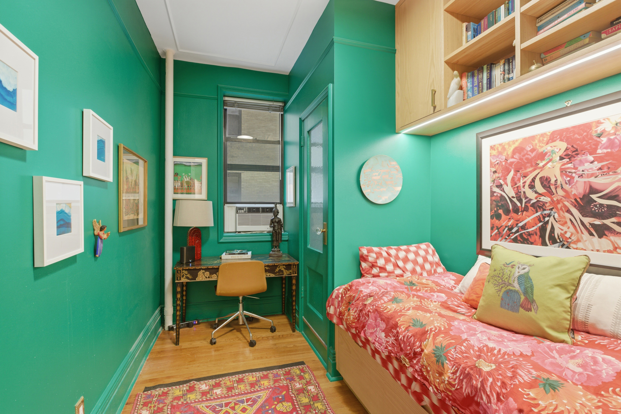 532 West 111th Street, Unit 26 Manhattan, NY 10025 - Photo 12 of 14 a bedroom with a bed and a chair