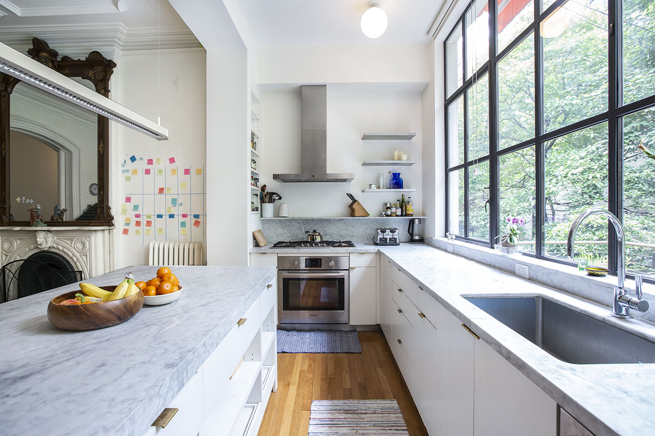 124 Park Place, Unit TRIPLEX Brooklyn, NY 11217 - Photo 2 of 15 a kitchen with granite countertop a sink and a stove top oven