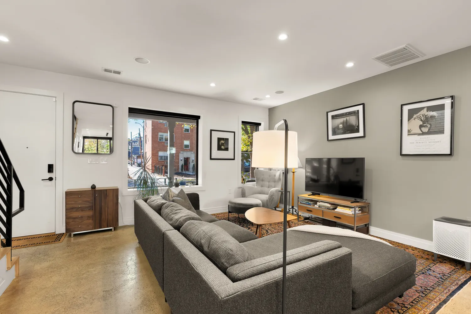 a living room with furniture and a flat screen tv