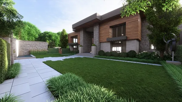 aerial view of a house with yard table and chairs