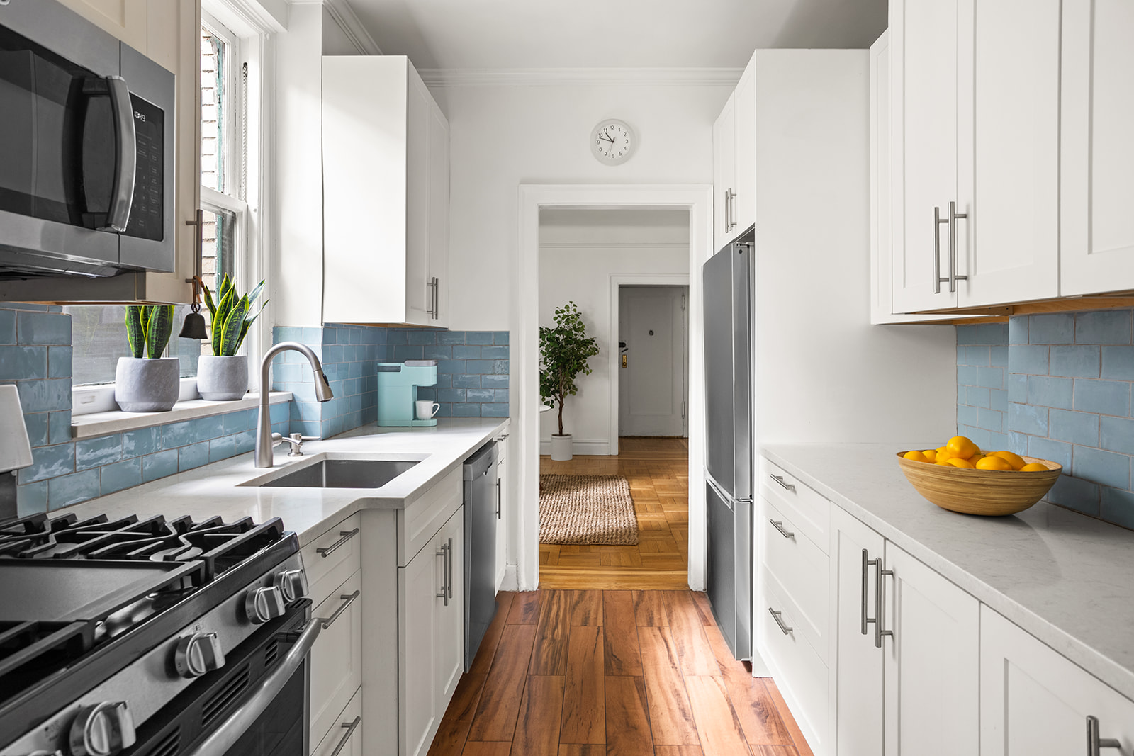35-47 80th Street, Unit 2 Queens, NY 11372 - Photo 4 of 12 a kitchen with stainless steel appliances granite countertop a sink stove and refrigerator