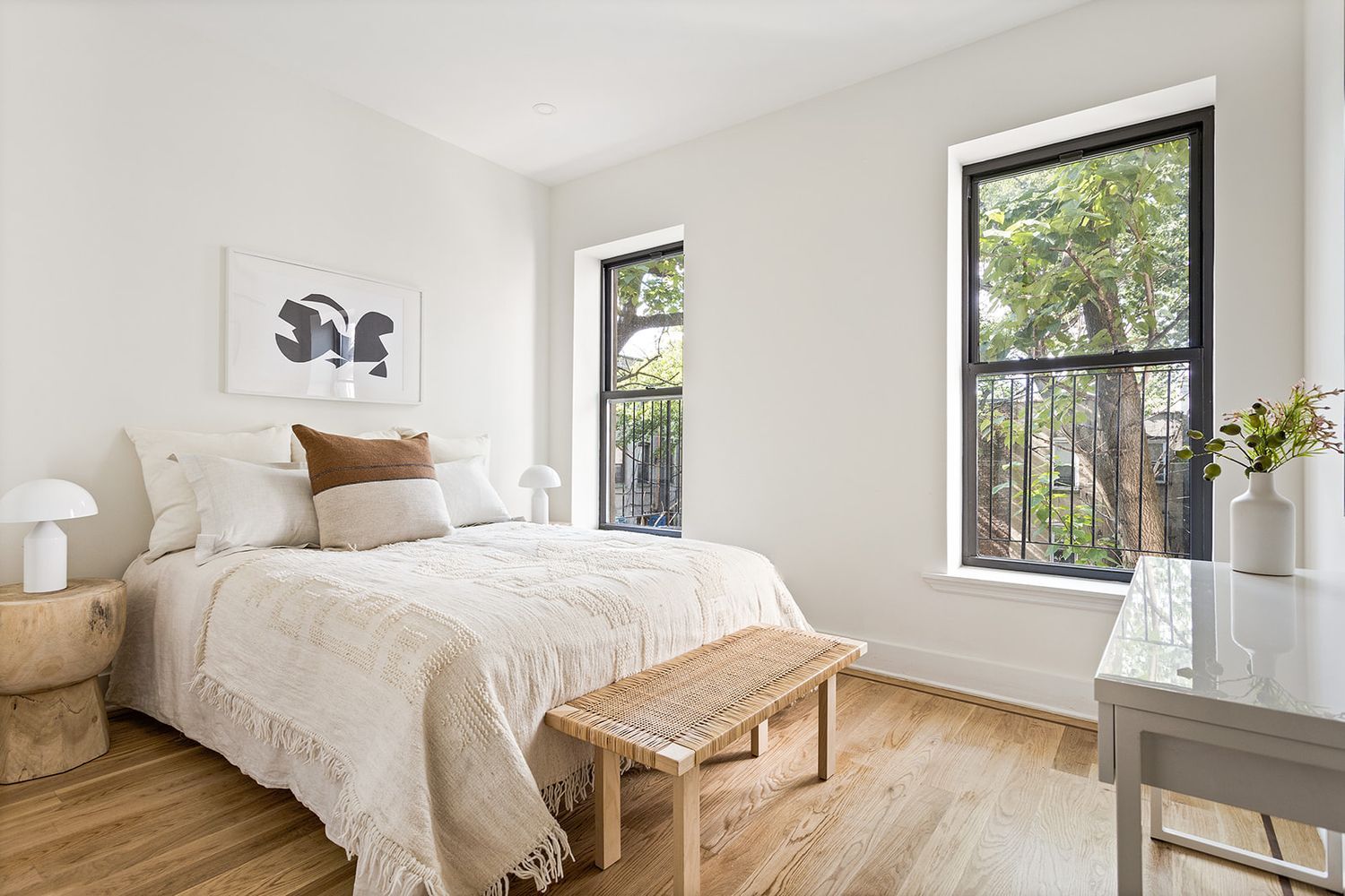 917 Saint Marks Avenue, Unit 3 Brooklyn, NY 11213 - Photo 7 of 12 a bedroom with a bed and wooden floor