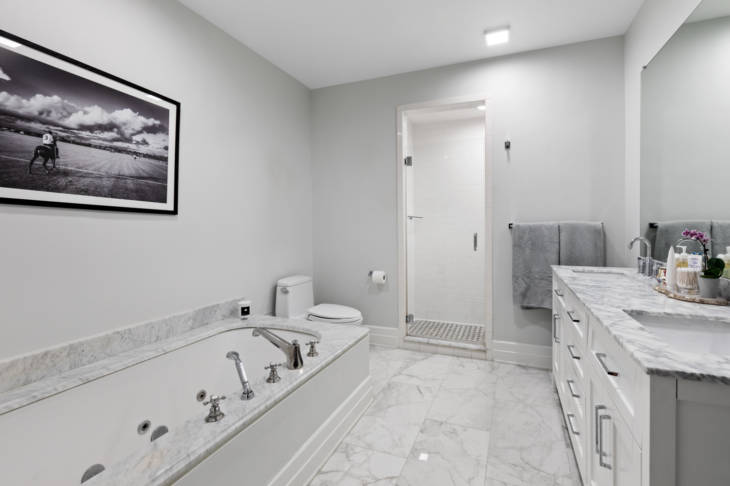 30 Main Street, Unit 3C Brooklyn, NY 11201 - Photo 9 of 18 a bathroom with a tub a sink and a mirror