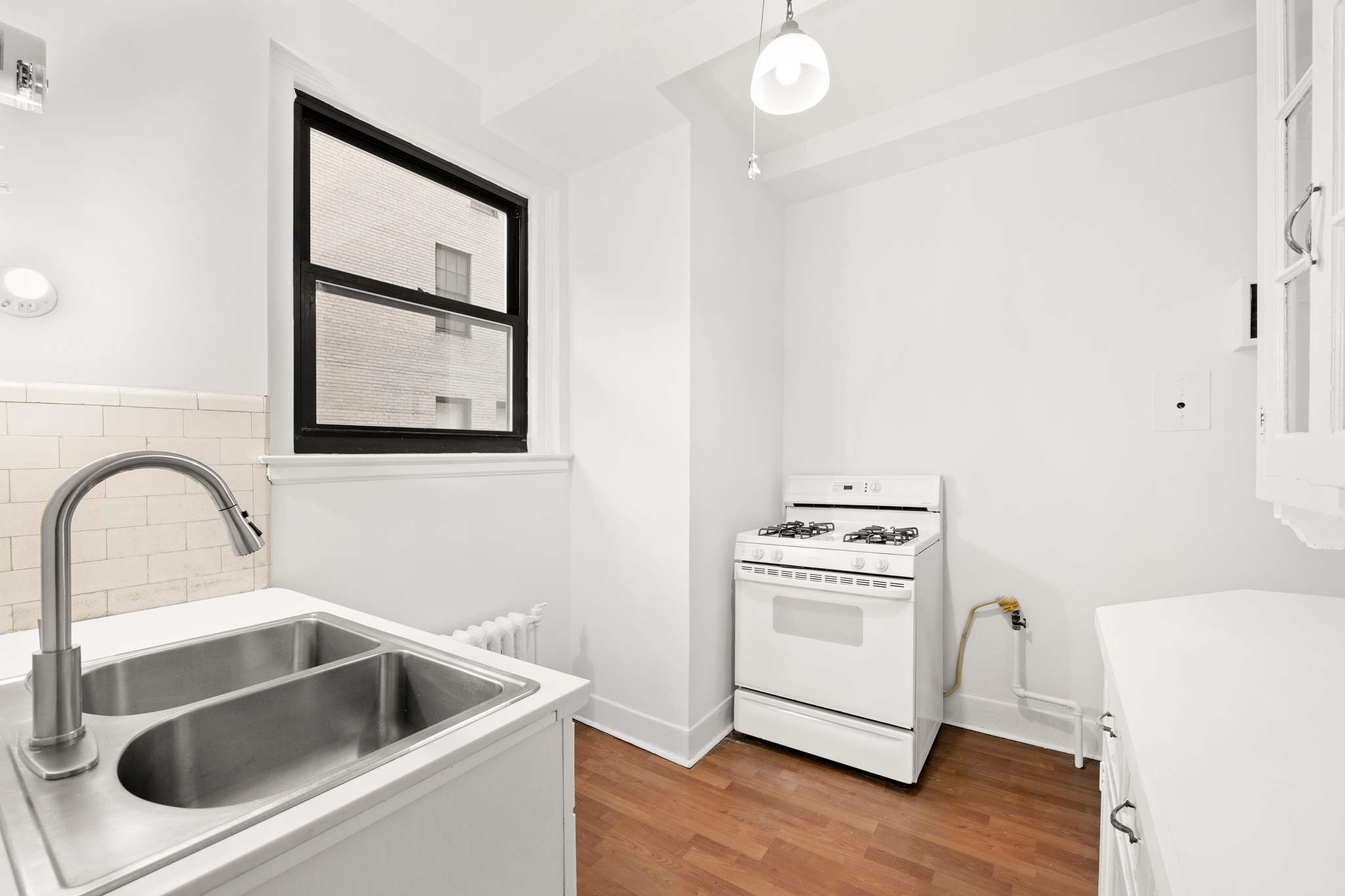 55 East 72nd Street, Unit 2NORTH Manhattan, NY 10021 - Photo 9 of 18 a kitchen with a stove and a sink