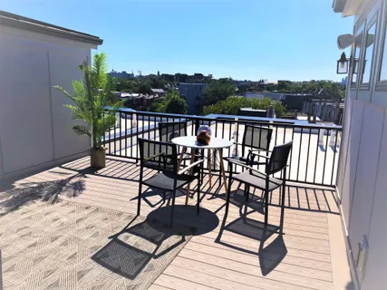 a view of a chairs on wooden deck