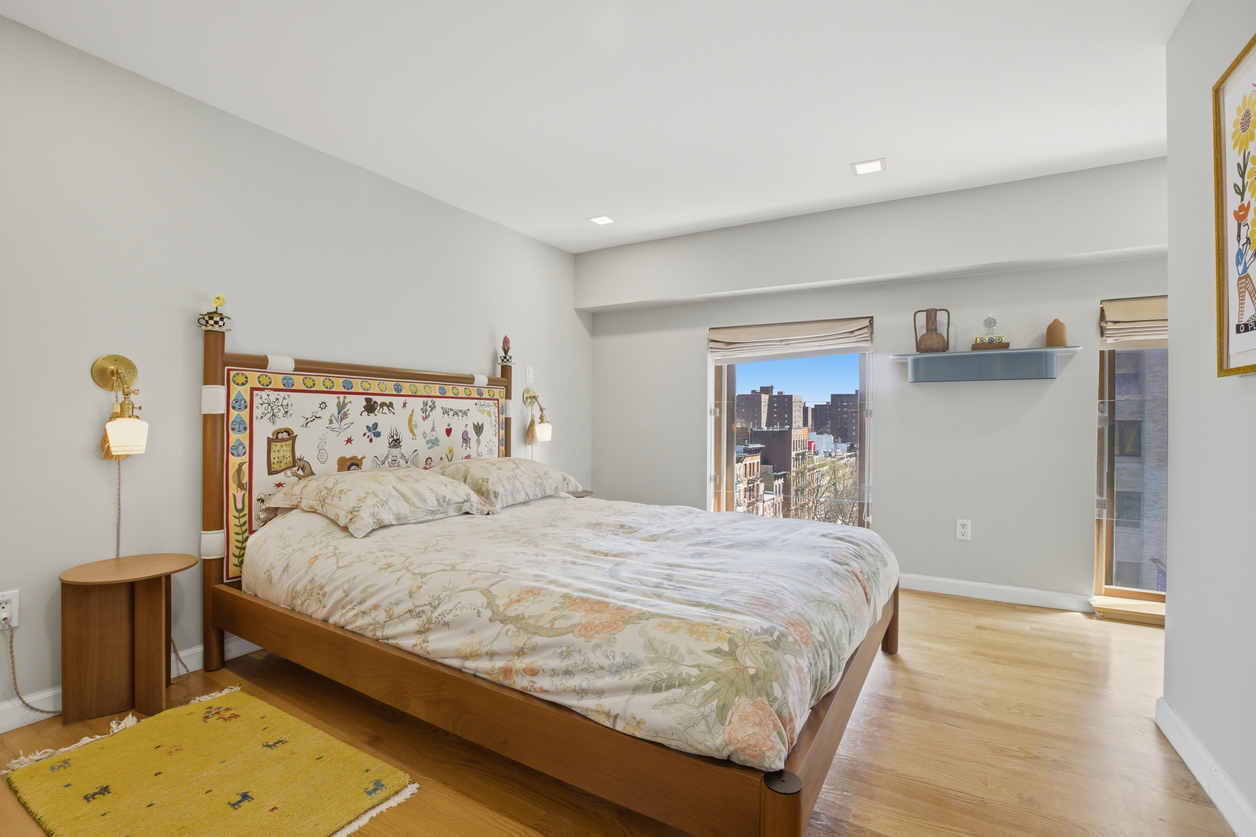 305 2nd Avenue, Unit 521 Manhattan, NY 10003 - Photo 7 of 20 a bedroom with a bed and a table in it