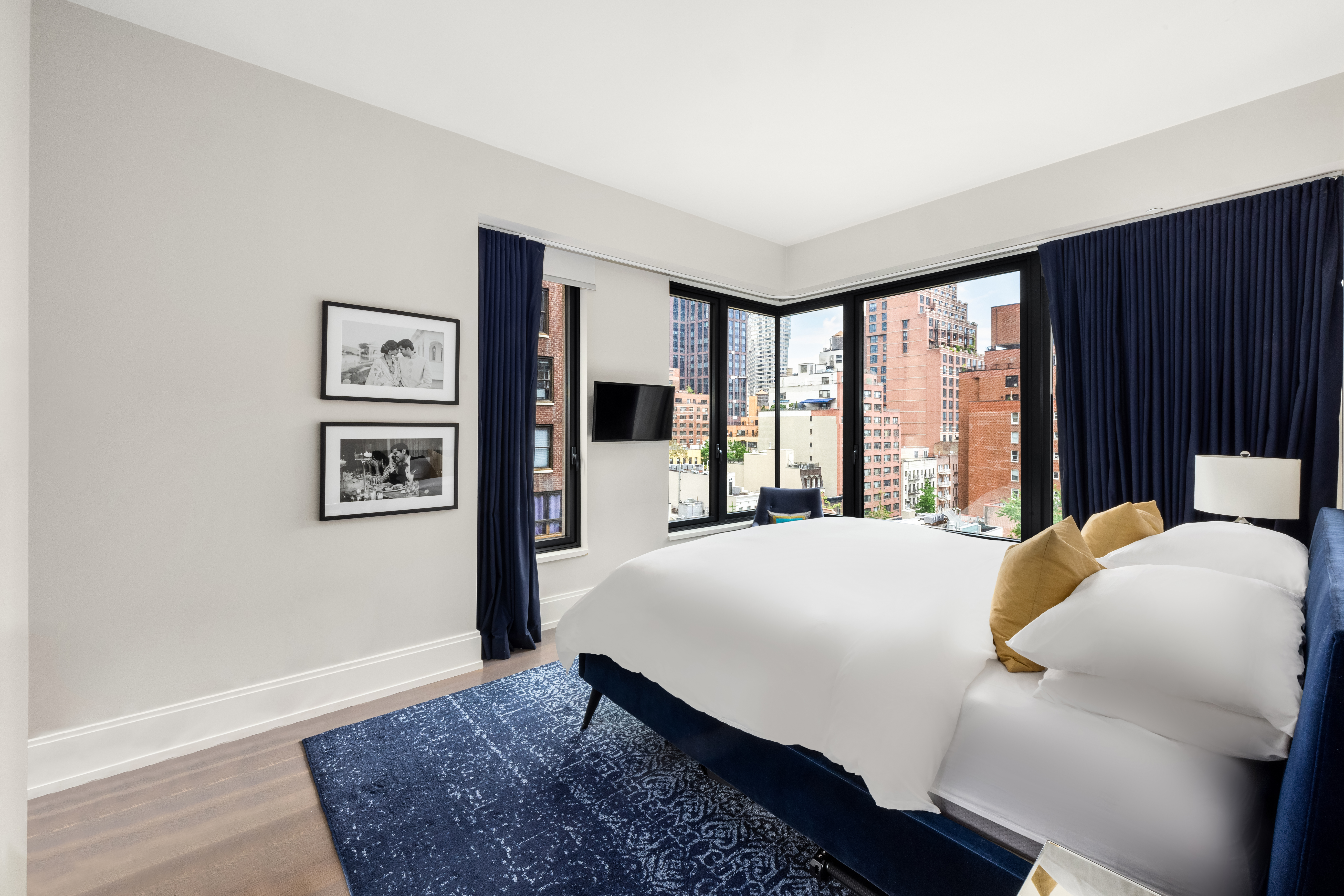 301 East 50th Street, Unit 8C Manhattan, NY 10022 - Photo 12 of 20 a bedroom with a bed and a large window