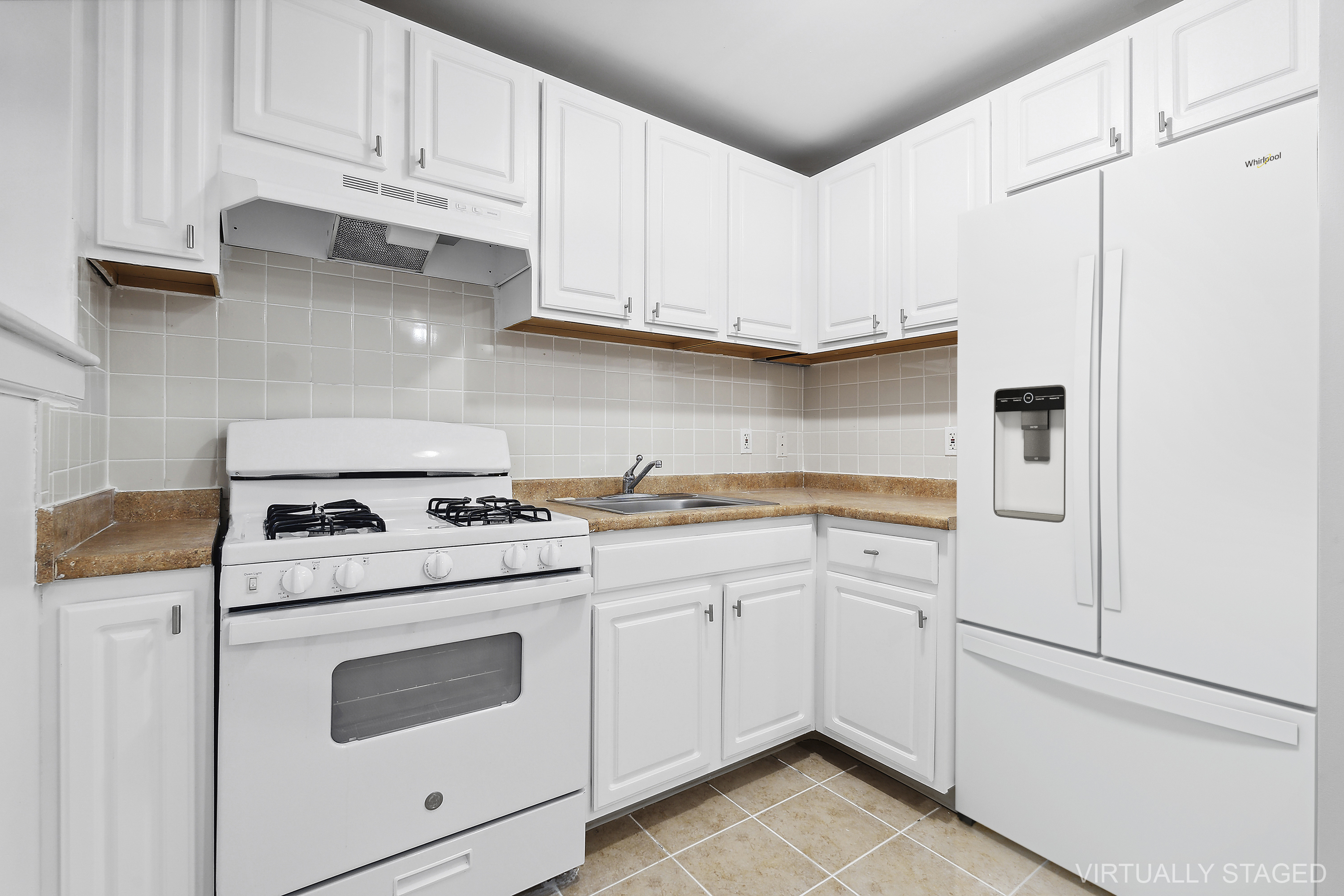 660 St Nicholas Avenue, Unit 33 Manhattan, NY 10030 - Photo 3 of 11 a kitchen with white cabinets and white appliances