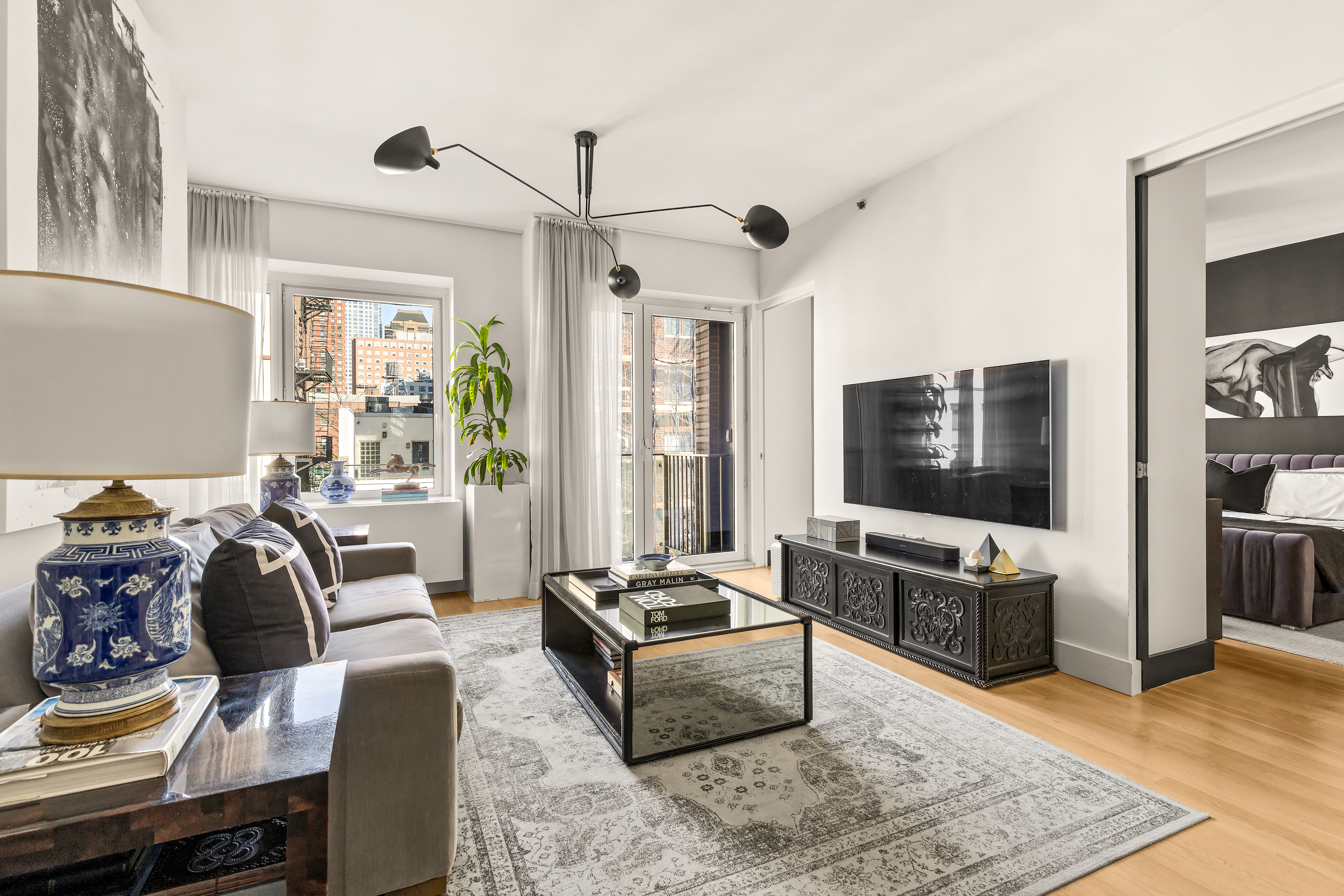 a living room with furniture and a flat screen tv