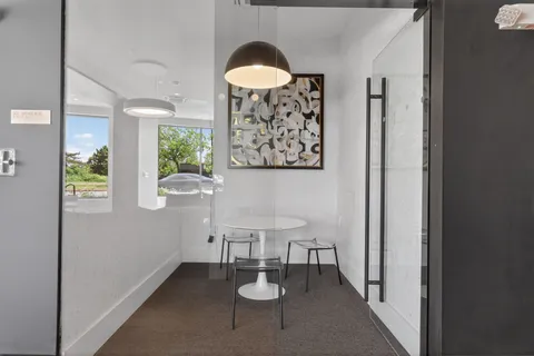a view of a bathroom with a sink and a mirror