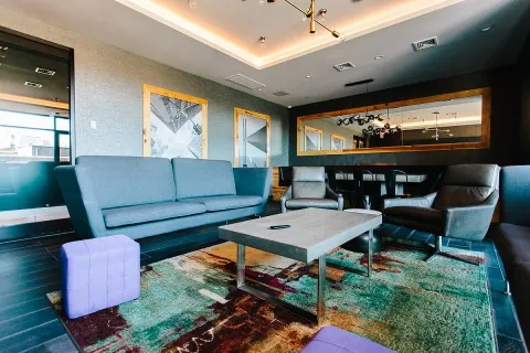 a living room with furniture and a flat screen tv