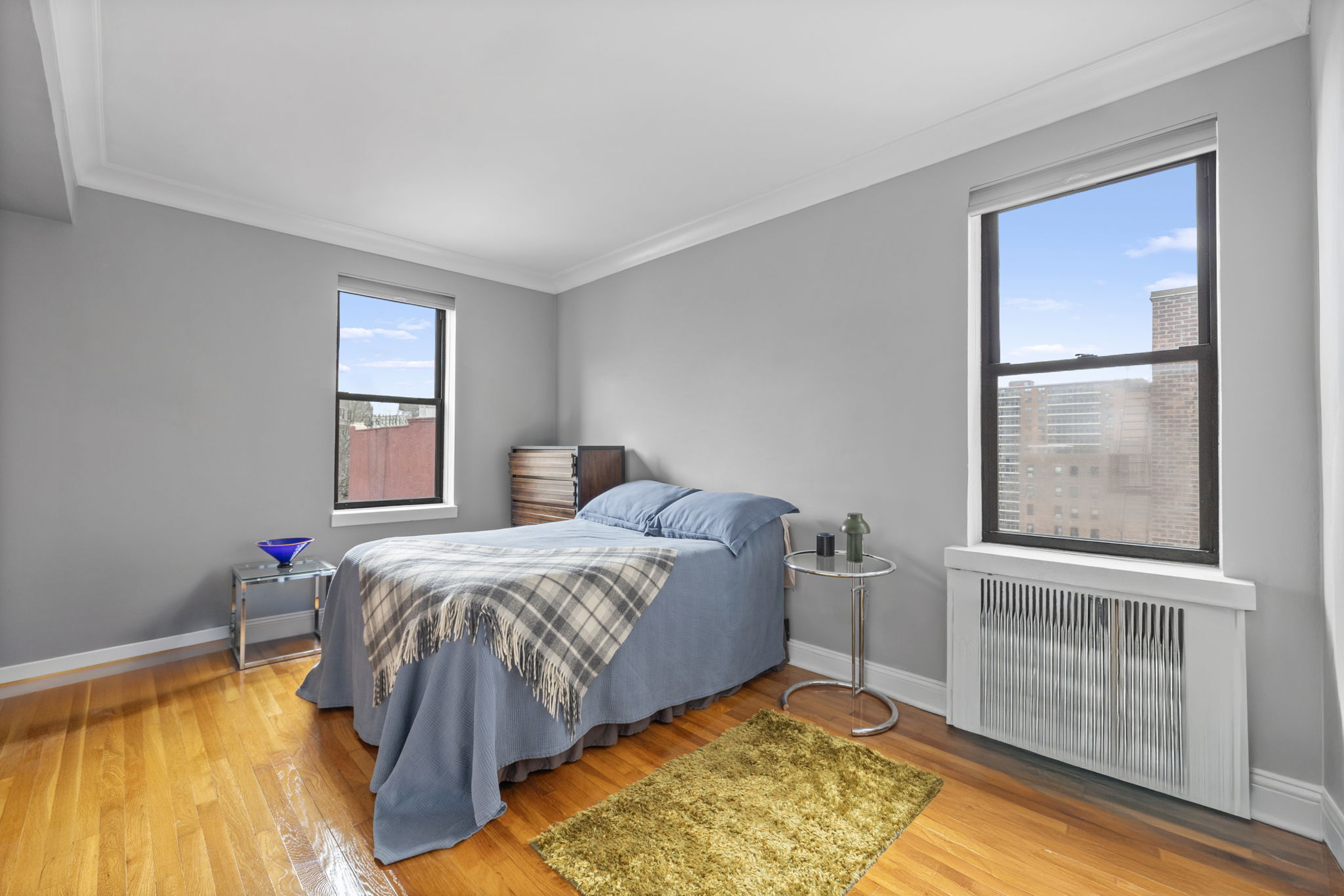 Riverside Dr W, Unit 6H Manhattan, NY 10032 - Photo 3 of 6 a bed sitting in a bedroom next to a window