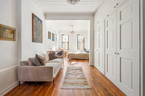 a living room with furniture and a rug