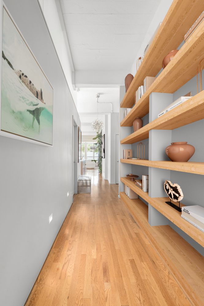 a hallway with toys and wooden floor