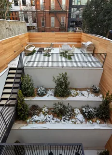 a view of a house with a yard and sitting area