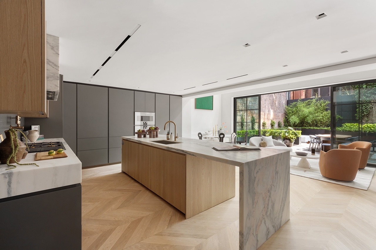 17 East 9th Street Manhattan, NY 10003 - Photo 6 of 32 a kitchen with a stove and a refrigerator