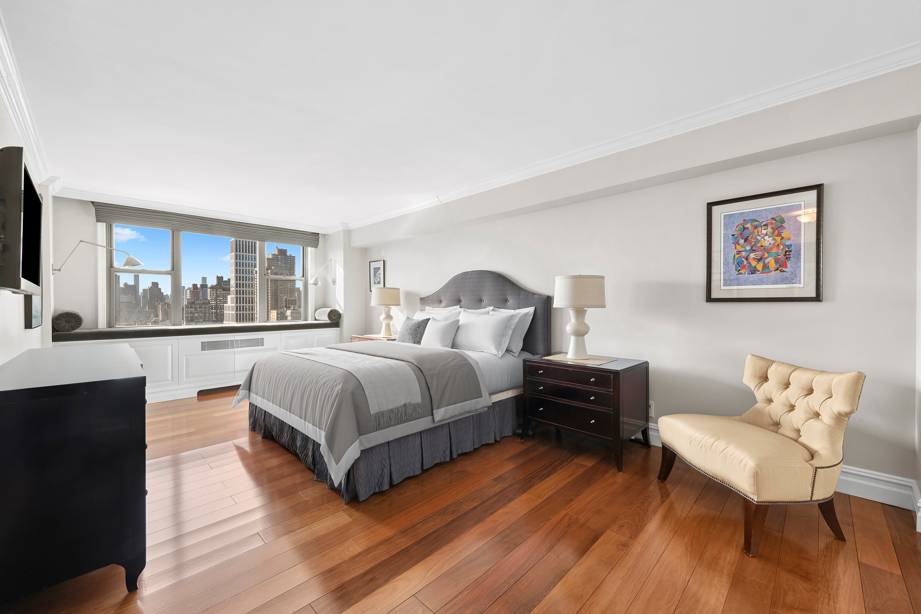 444 East 86th Street, Unit 25EF Manhattan, NY 10028 - Photo 5 of 18 a large bedroom with a bed and wooden floor