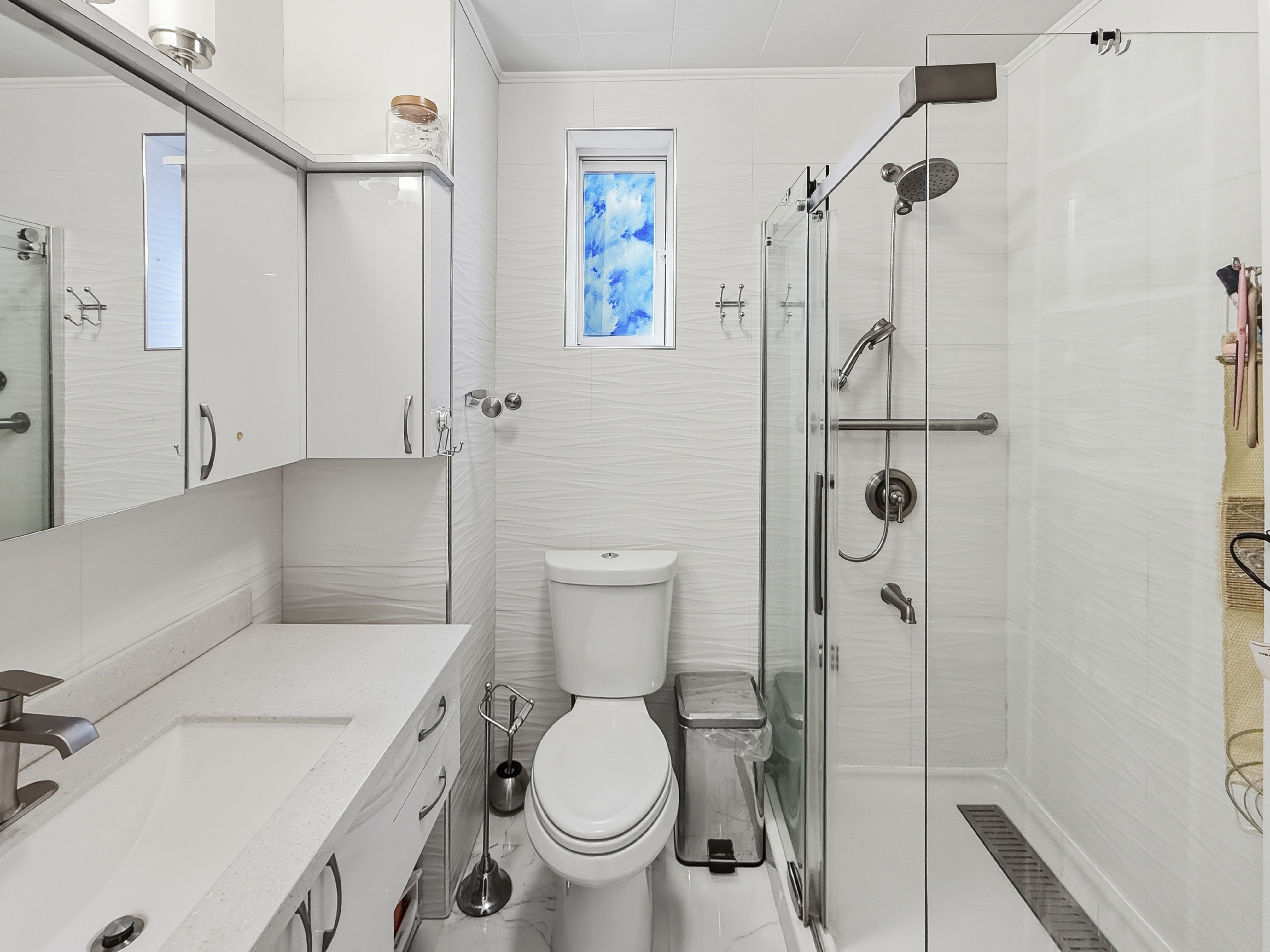 3735 Oceanic Avenue Brooklyn, NY 11224 - Photo 10 of 26 a bathroom with a toilet and a shower