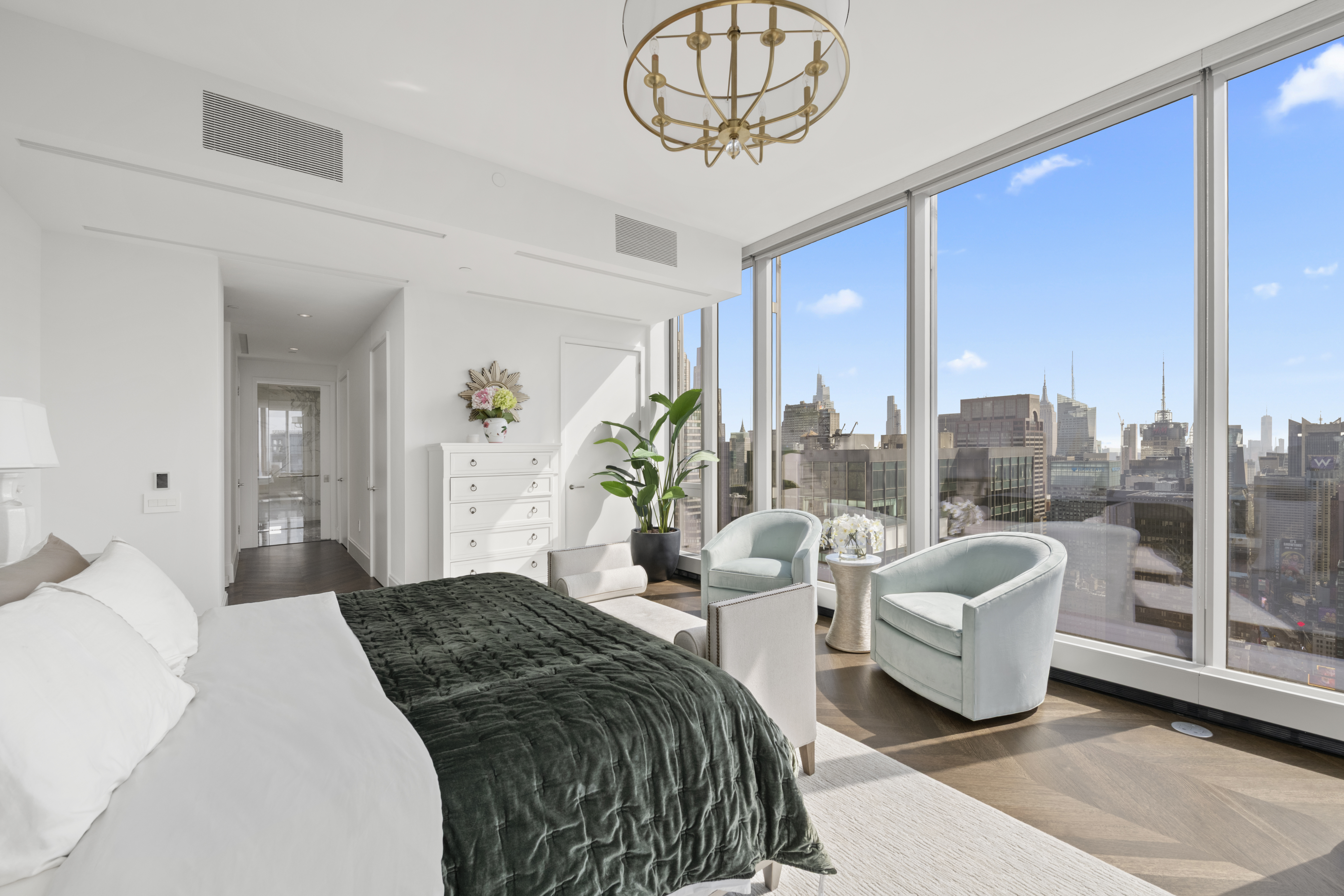 217 West 57th Street, Unit 58W Manhattan, NY 10019 - Photo 11 of 30 a bedroom with bed and a large window