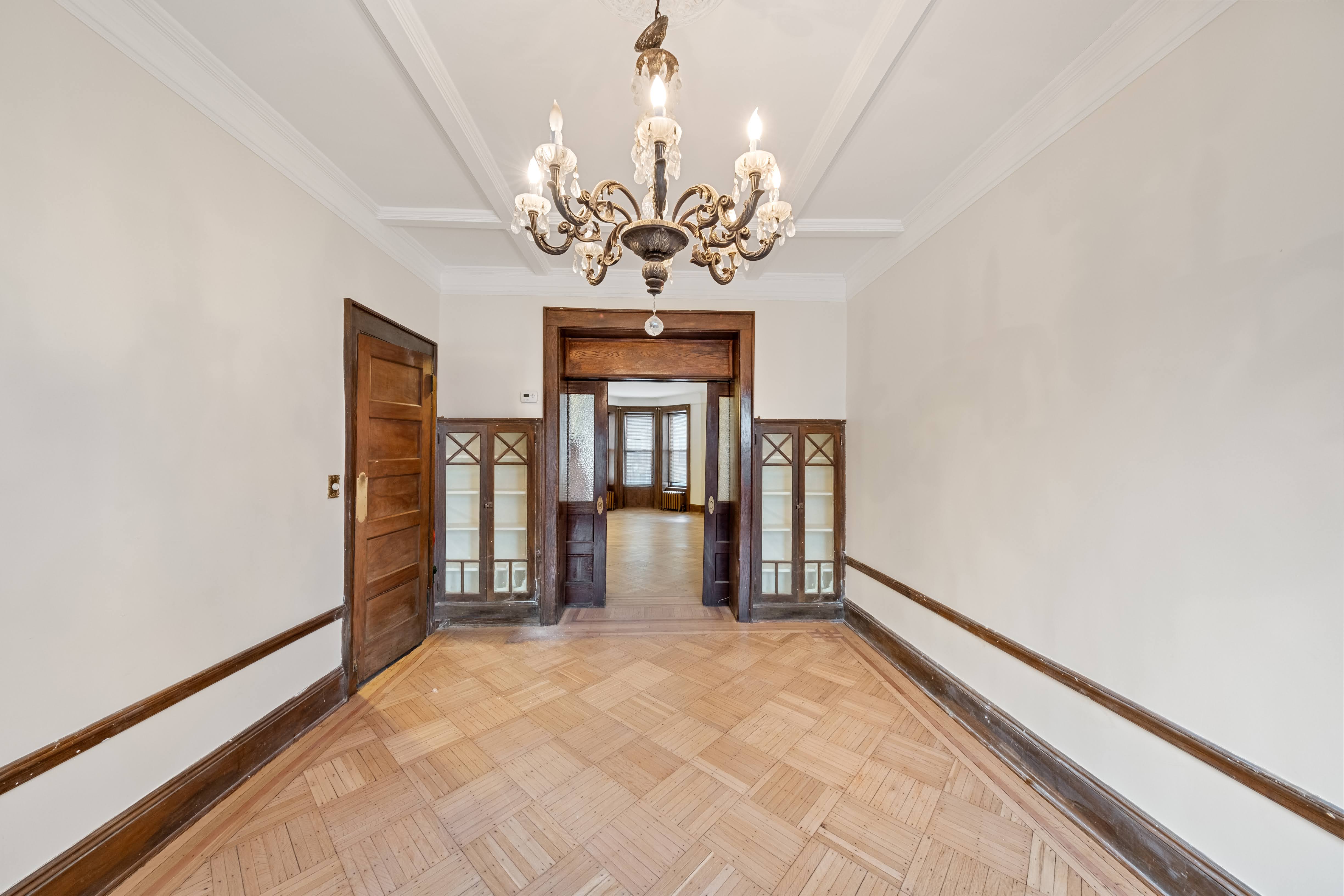 196 Maple Street Brooklyn, NY 11225 - Photo 7 of 31 a view of an empty room with a window