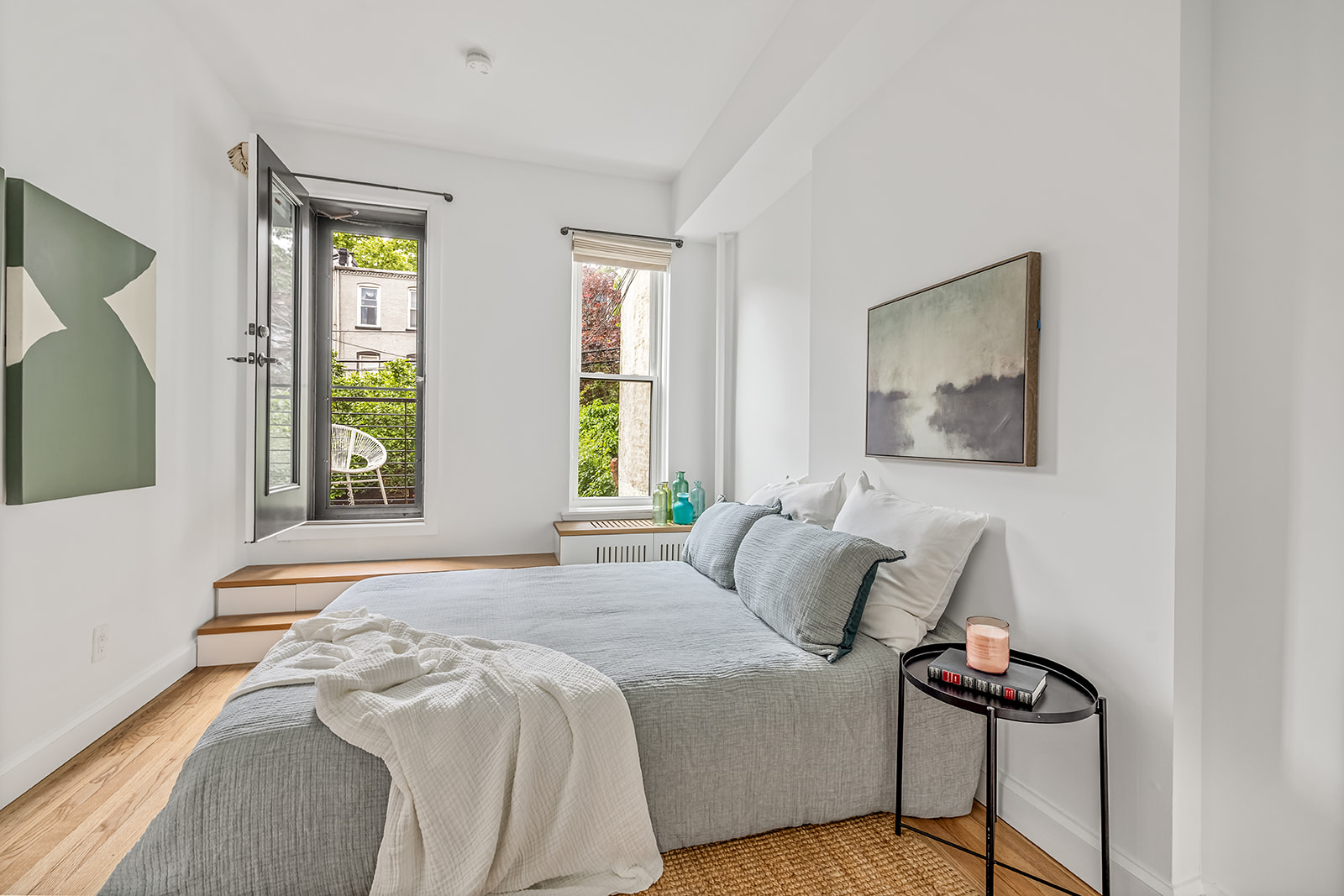 482 12th Street, Unit 1 Brooklyn, NY 11215 - Photo 4 of 10 a bedroom with a bed and two windows