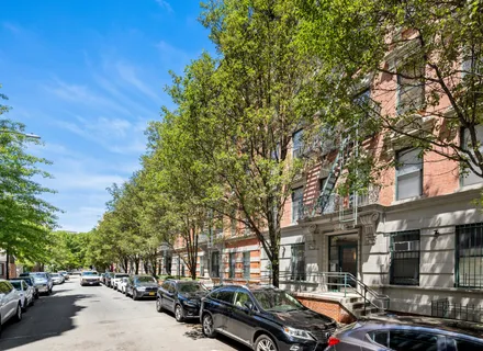 a city street lined with buildings and cars