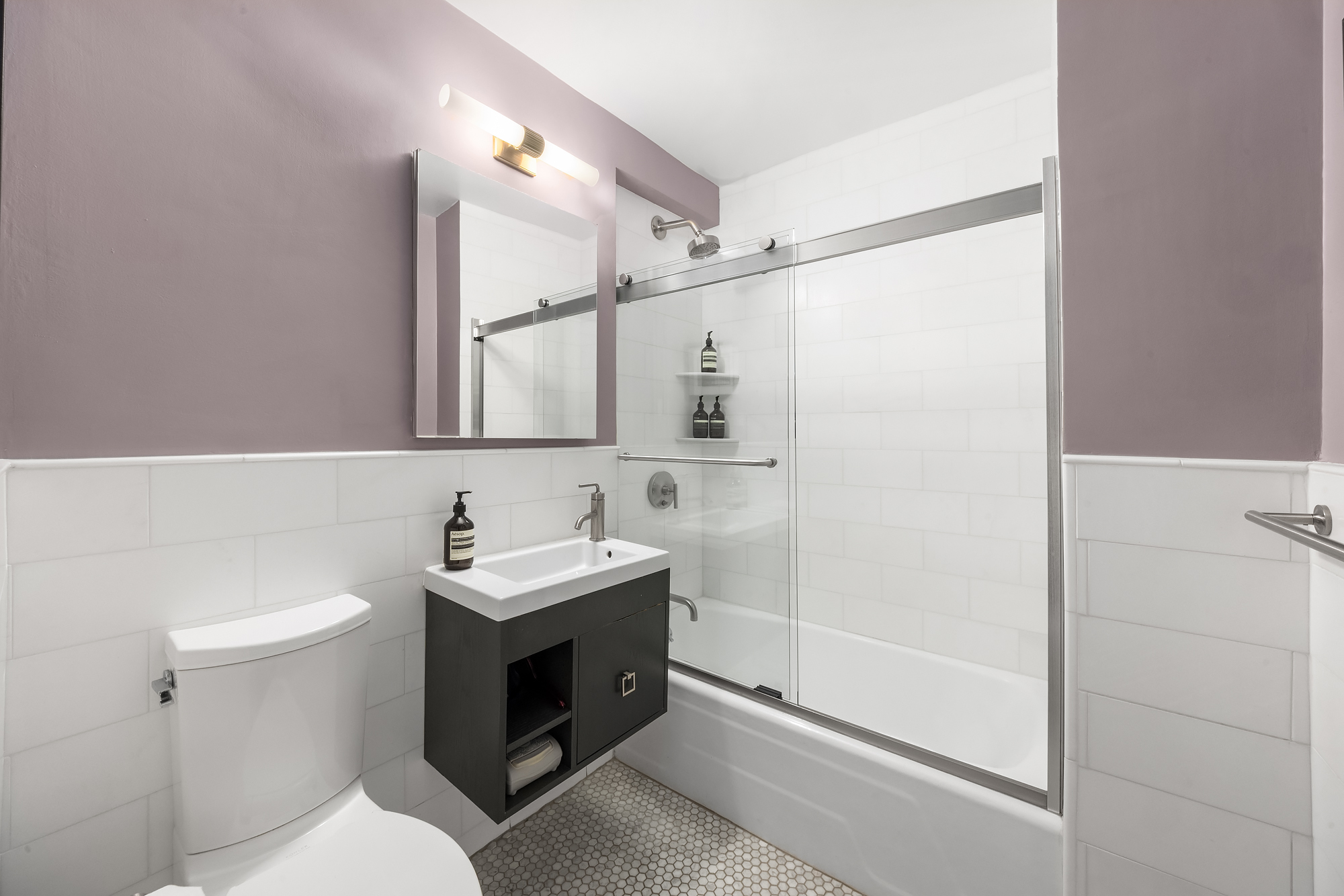 101 West 12th Street, Unit 8N Manhattan, NY 10011 - Photo 12 of 17 a bathroom with a sink toilet and shower